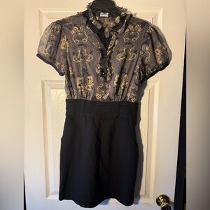 Elegant Bebe Black and Gold Floral Dress with fitted black skirt bottom